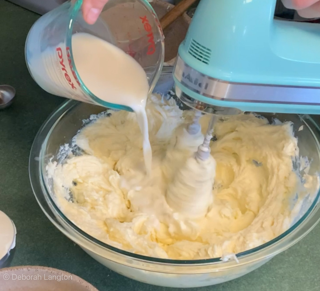 Blending Milk into Classic Cheesecake Recipe