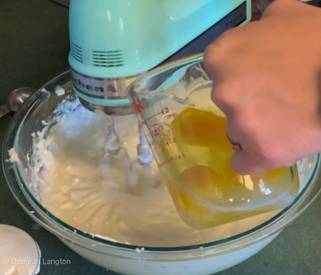 Blending one egg at a time into Classic Cheesecake Recipe