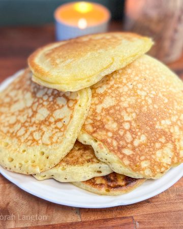 Pile of sourdough discard pancakes on a plate