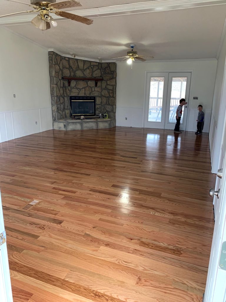 Finished hardwood floors in the renovated living room