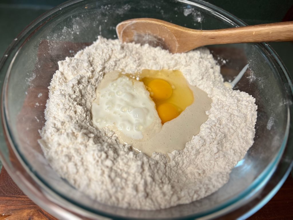 Sourdough discard, eggs, and buttermilk added to flour for dumpling dough