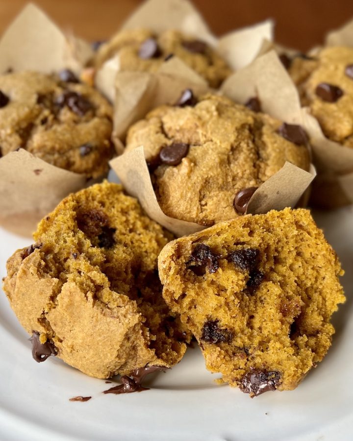 Fresh-milled pumpkin chocolate chip muffins with tall golden tops and a soft, moist crumb