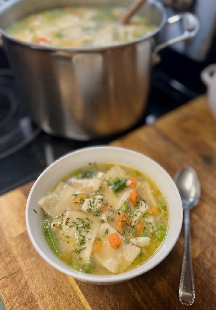 Homemade chicken and sourdough discard dumpling served warm with mixed vegetables