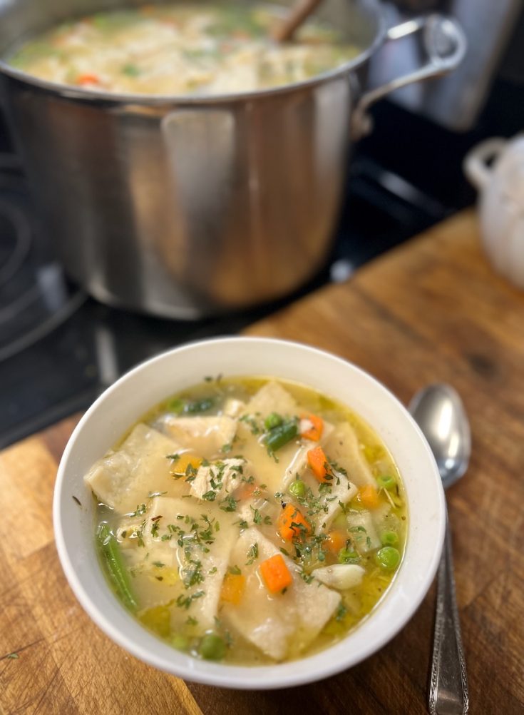 Sourdough discard chicken and dumplings with homemade rolled dumplings, chicken, and mixed vegetables.