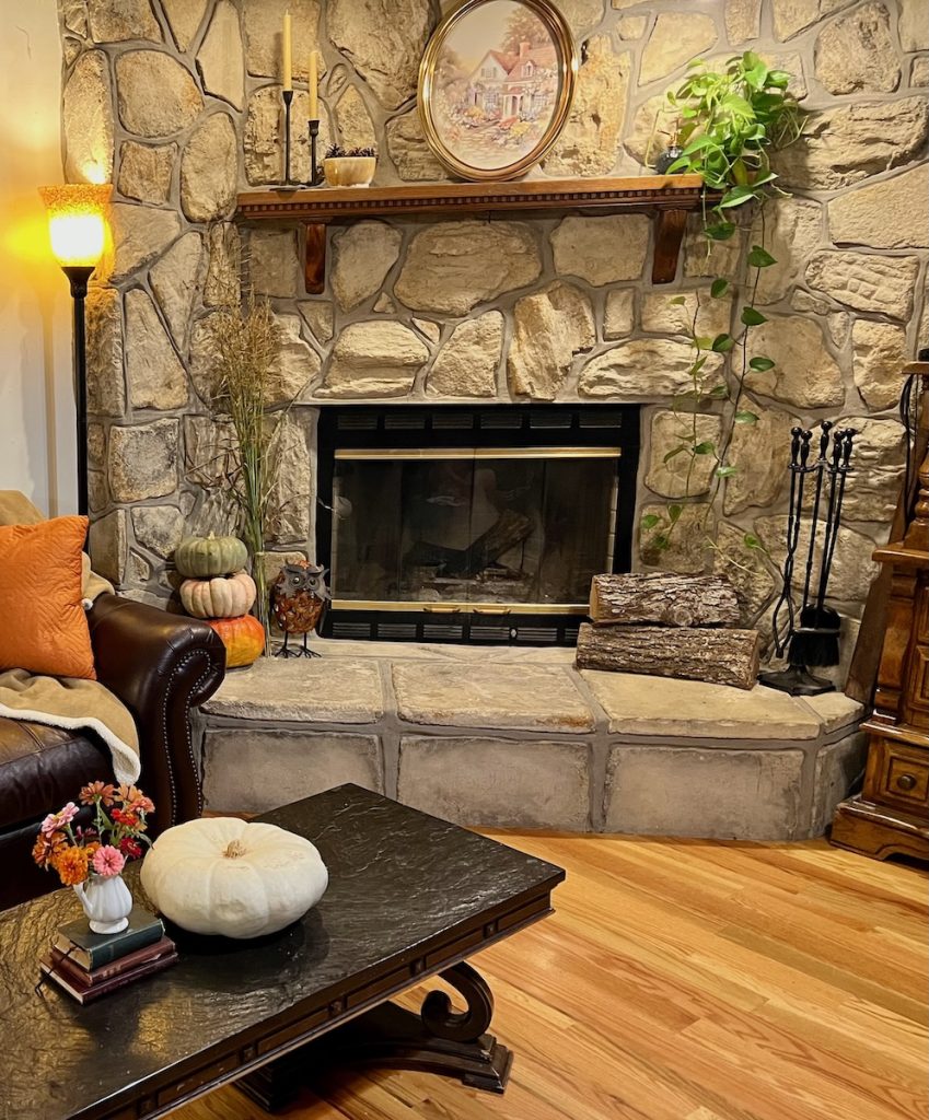Fireplace after clutter removed, breathing space created, and cozy fall decor added